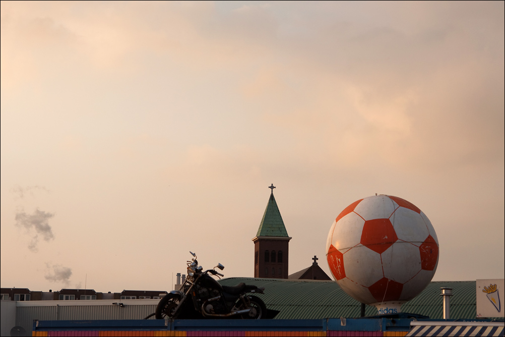 A Motorcycle, a Church and a Ball